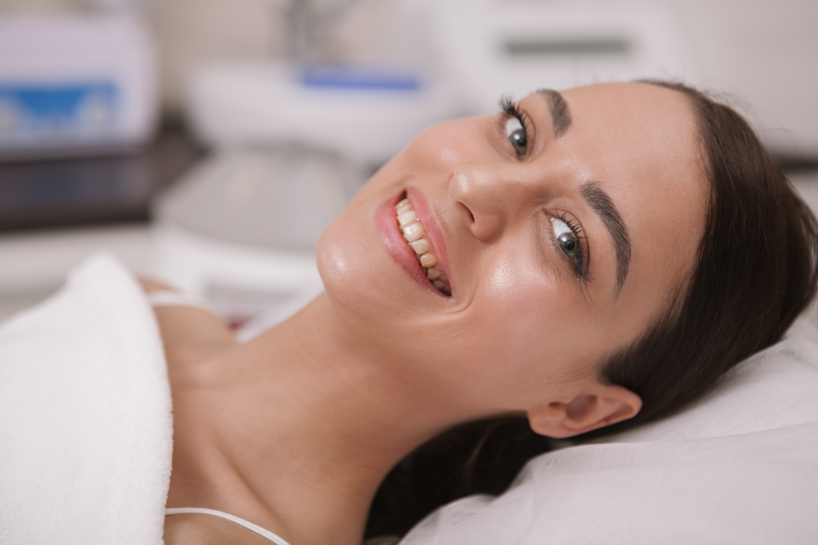 Beautiful young woman getting facial skincare treatment