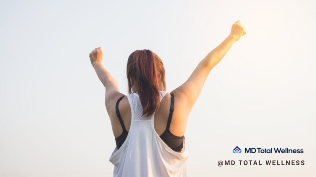 Why MD Total Wellness is Orange County’s Go-To Wellness Center 1 Woman doing workout under MD Total wellness center orange county